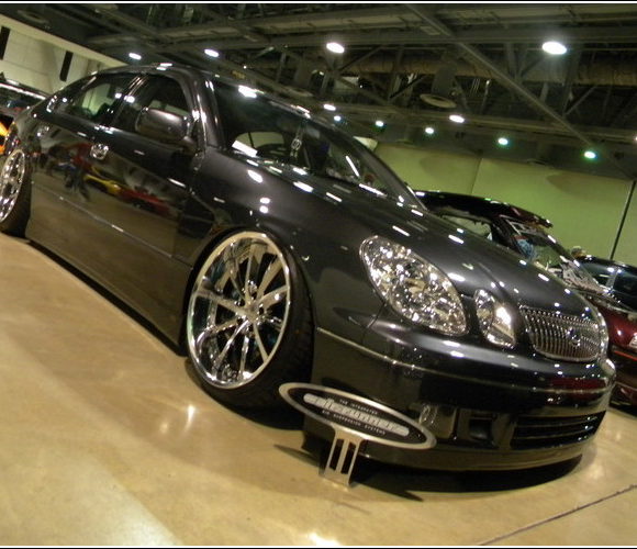 Dark Lexus photographed at an automotive show