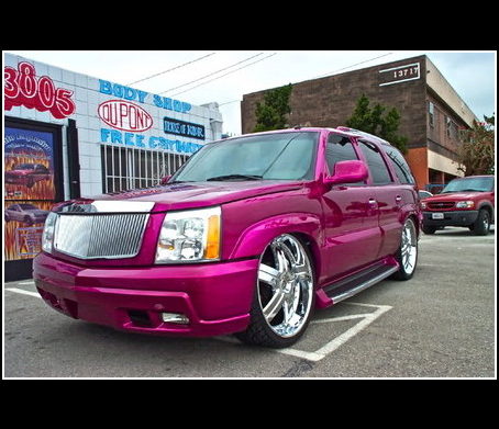 Pink Cadillac parked outside Auto Explosion