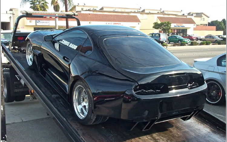Dark coupe photographed outside Auto Explosion