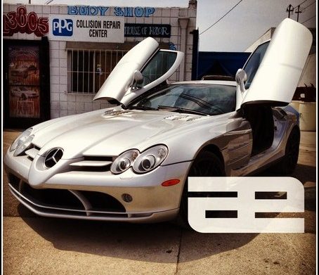 Silver Mercedes-Benz with doors open at the shop