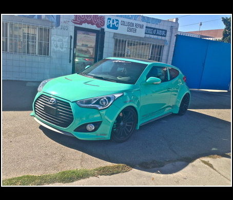 Mint-colored Hyundai photographed outside Auto Explosion